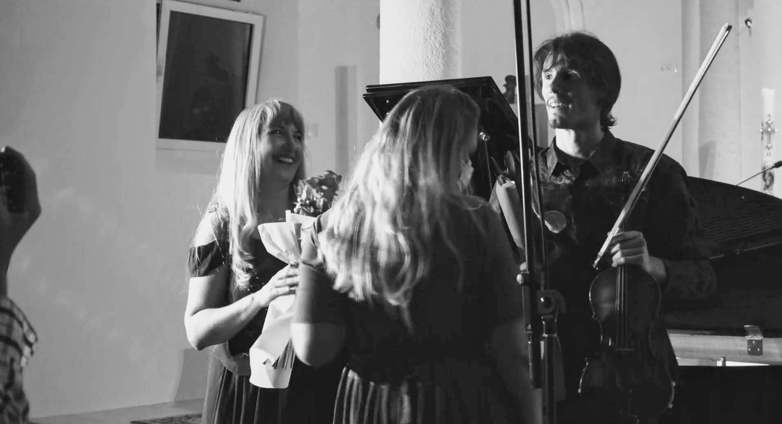 Melita Lasek Satterwhite receives flowers with Edi Šiljak after a violin and piano recital at St. Agnes church in Medulin, Croatia.